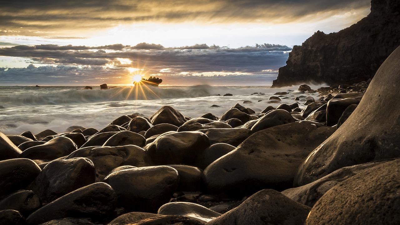 rocks beach sea ocean sun sunset 1239727